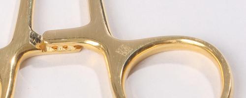 Laser marking of a datamatrix code on a medical clamp