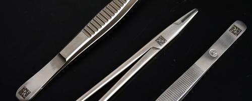 Laser-marked surgical tweezers with datamatrix code for medical traceability